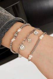 Zilveren bedelarmband met vijf smileys stainless steel LoveSieraden