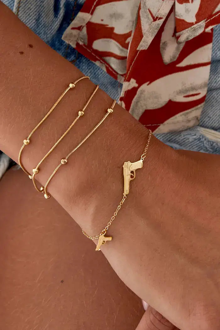 gouden armband met pistool