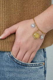 armband met drie zonnebedels goud en zilver model