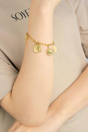 Gouden bedelarmband met palmboom en zon stainless steel LoveSieraden