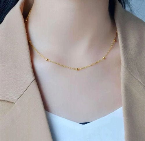 Ketting titanium en goud met chique bolletjes - LoveSieraden